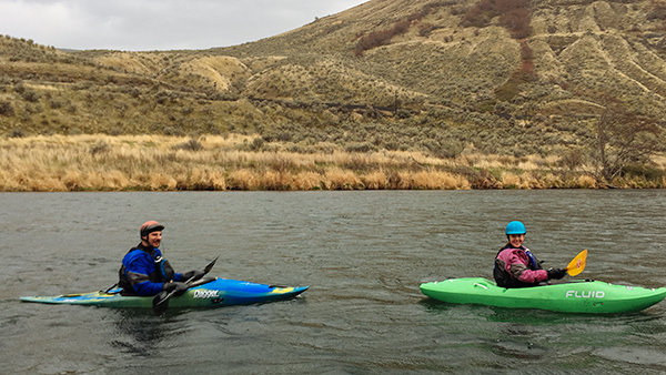 Emily and Chris kayaking on the Deschutes River